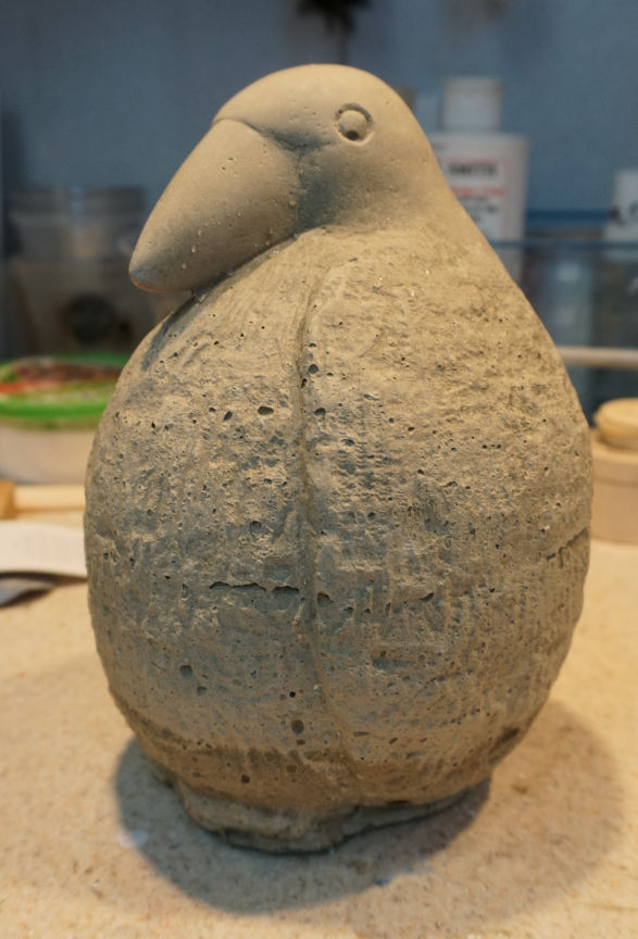 photo of cement cast fat baby bird