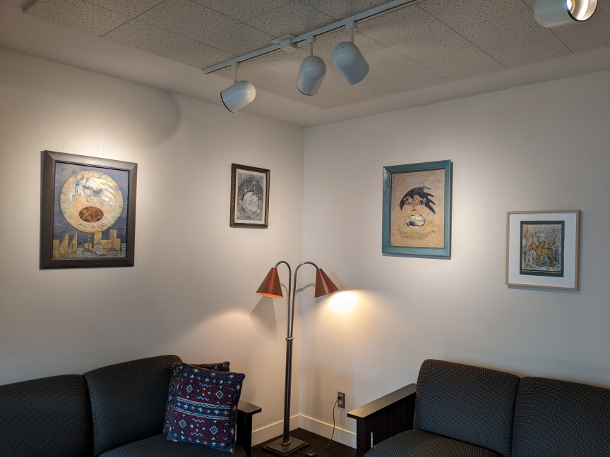 photo of four artworks hung in waiting room